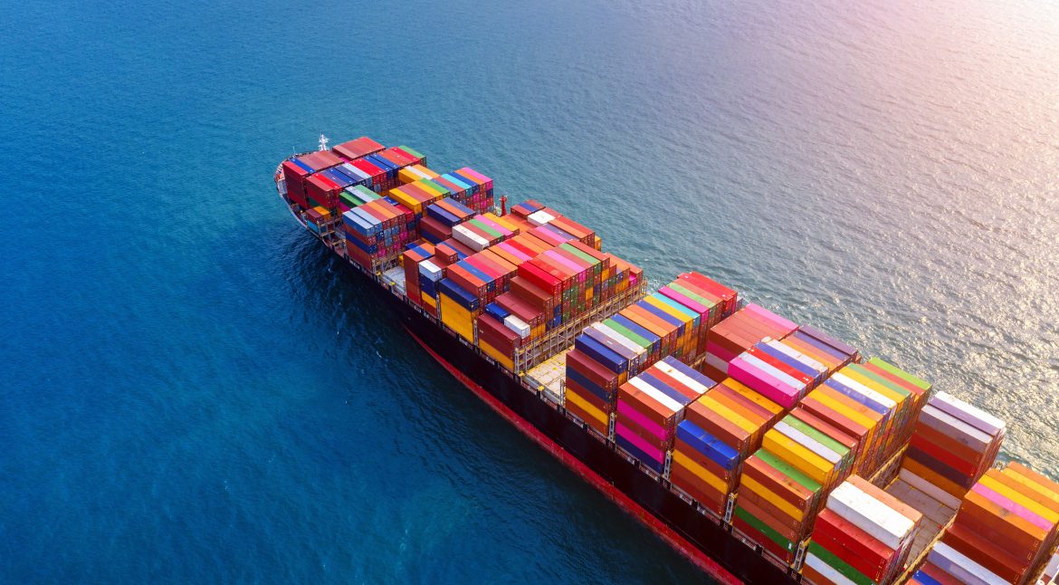 Aerial view of container cargo ship in sea.